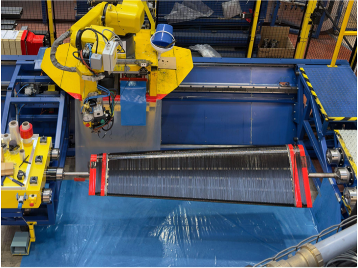 CompoTech's 6-axis Automated Fibre Laying (AFL) robotic winding system laying carbon fibre tow onto a mandrel on the production line